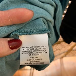 Terra Sky Size 1X Teal. Laced arms. Made of spandex and rayon.